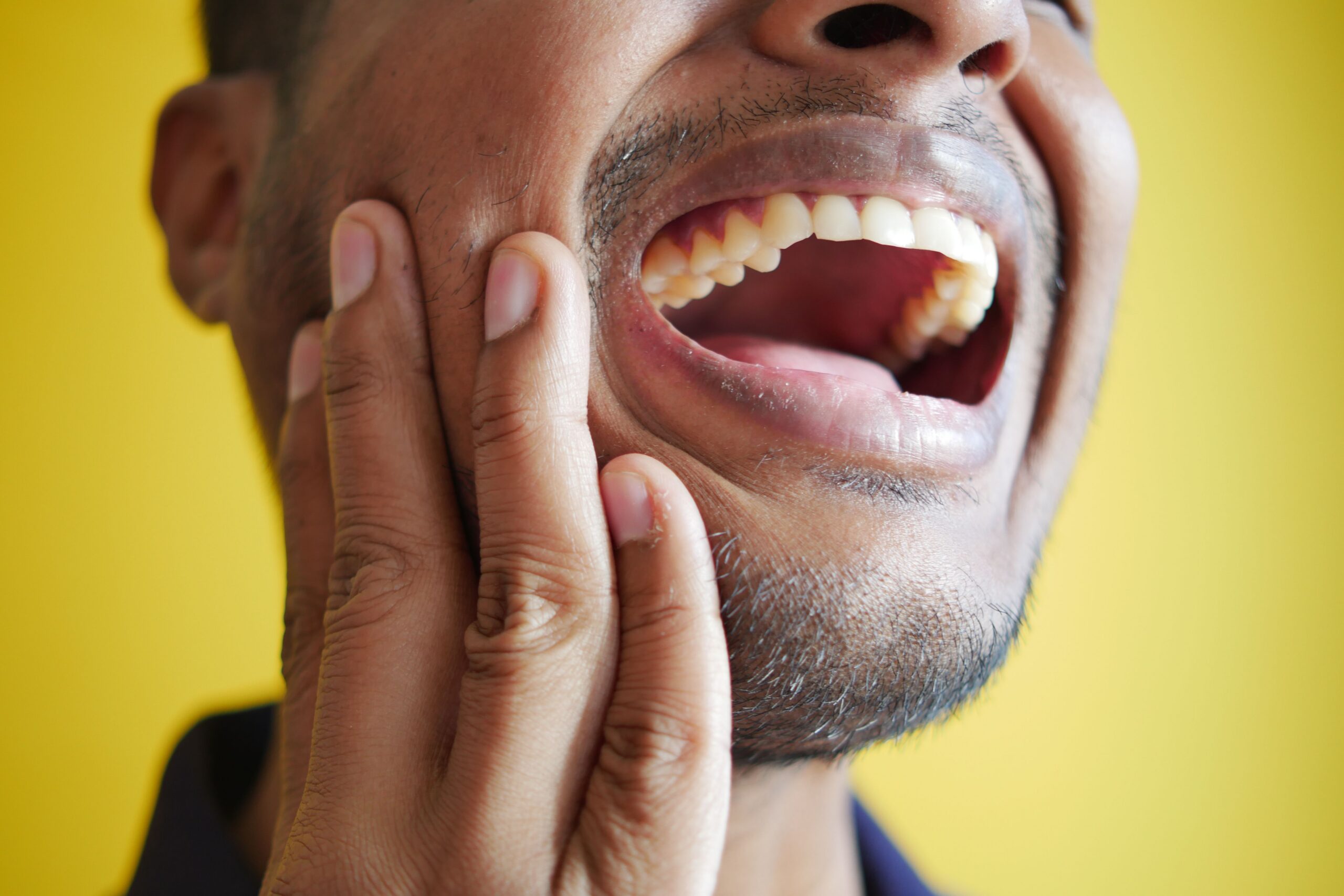 Dentist evaluating a patient as a candidate for TMJ treatment at Deerfoot Dental Centre