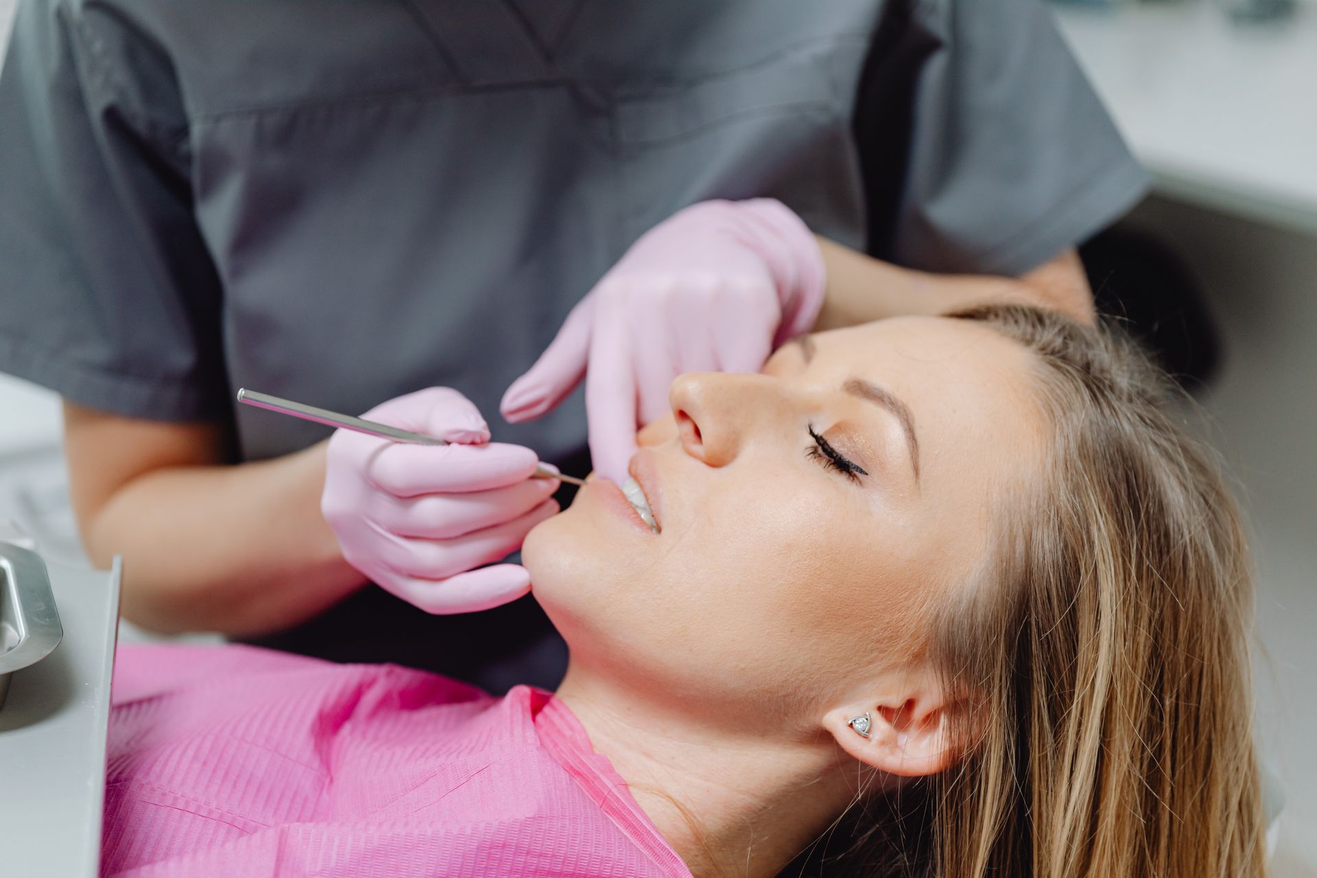Patient experiencing TMJ disorder symptoms before seeing a dentist